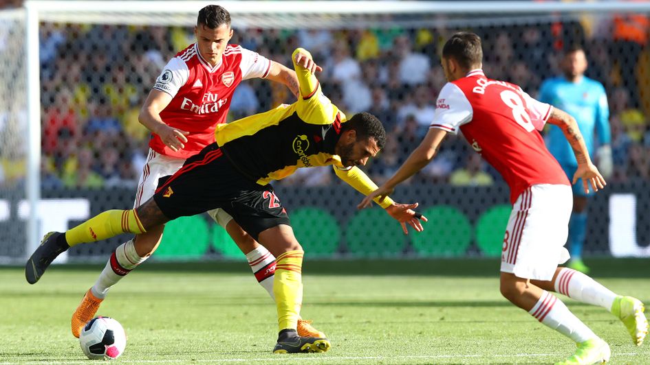 Granit Xhaka looks to win the ball from Watford's Etienne Capoue