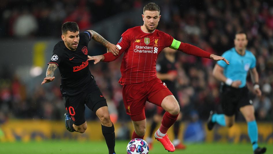Jordan Henderson and Angel Correa battle for the ball