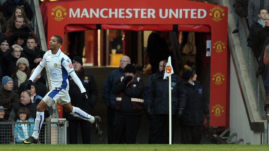 Jermaine Beckford celebrates scoring Leeds' winner at Old Trafford in 2010