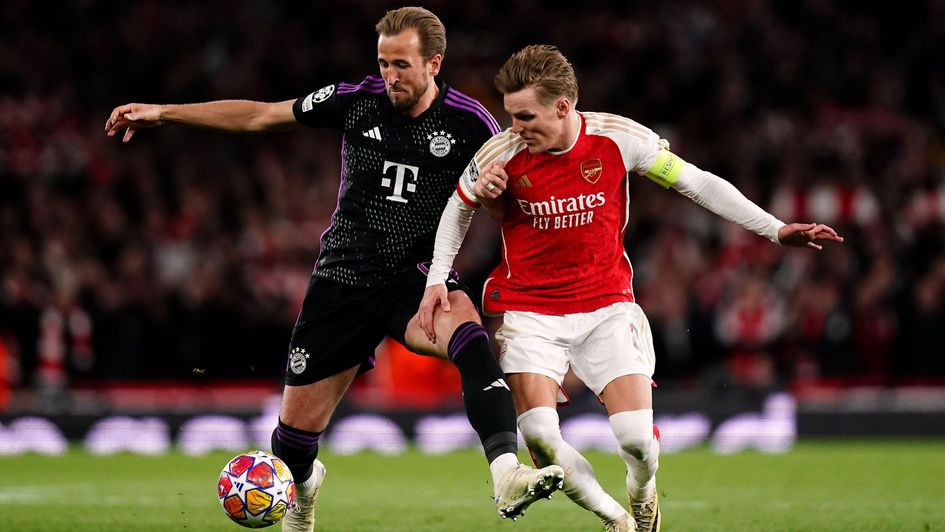 Harry Kane and Martin Odegaard (right) battle for the ball