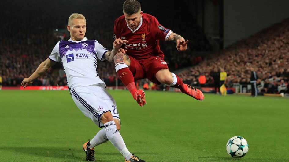 Liverpool's Alberto Moreno is tackled