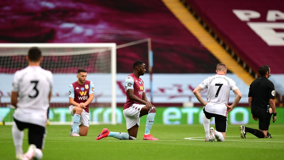 Aston Villa and Sheffield United players take a knee before the Premier League's first game of the restart