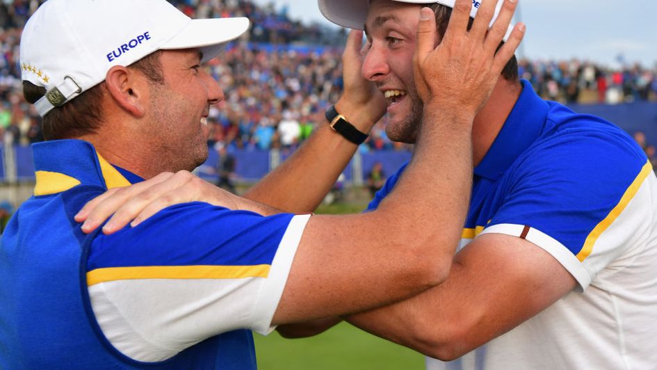 Sergio Garcia and Jon Rahm embrace after victory for Europe in Paris