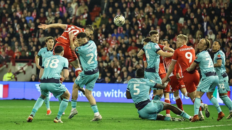Adam Phillips heads on goal
