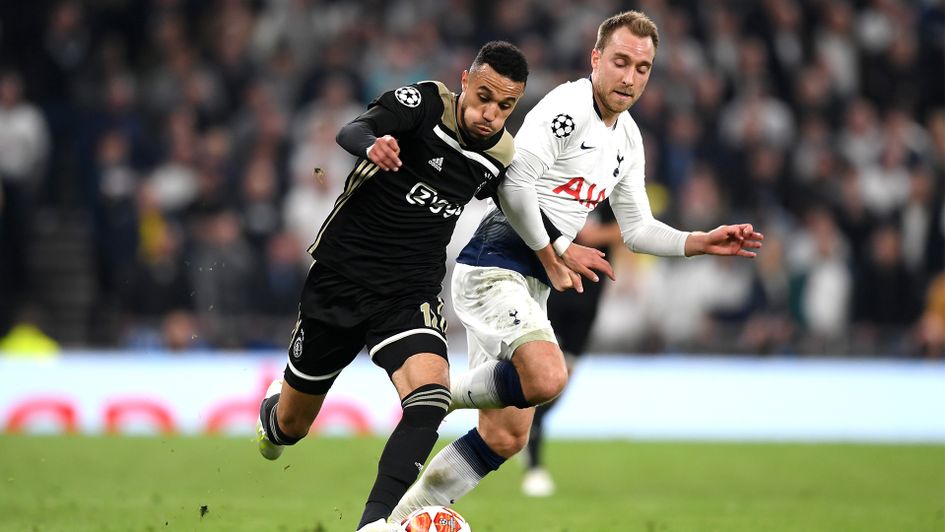 Noussair Mazraoui takes on Christian Eriksen