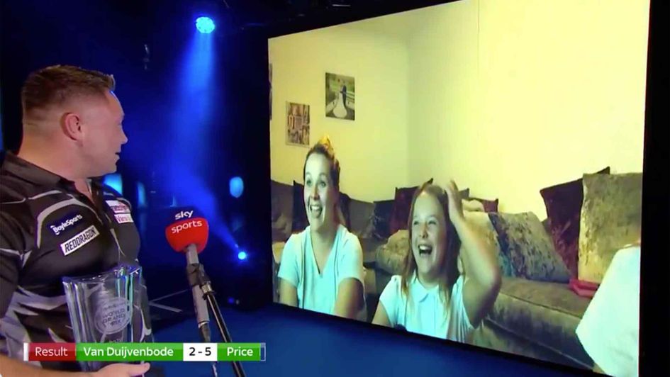 Gerwyn Price and his family on the big screen after winning the World Grand Prix