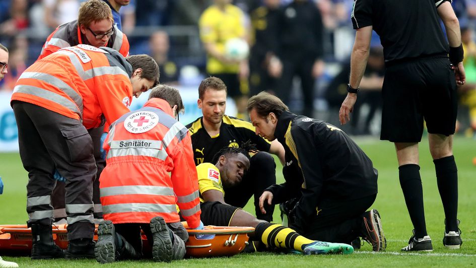 Michy Batshuayi receives treatment during Borussia Dortmund's match with Schalke