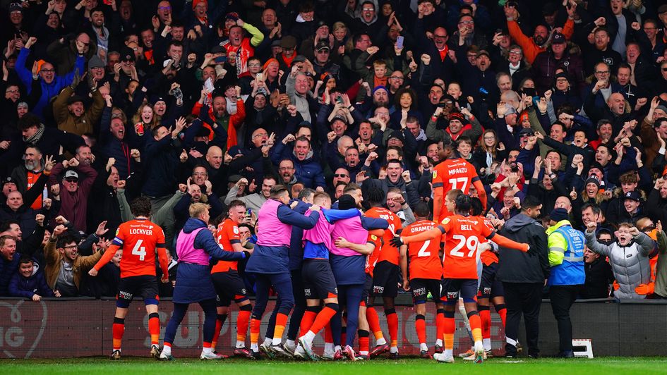 Luton players celebrate a goal against Watford