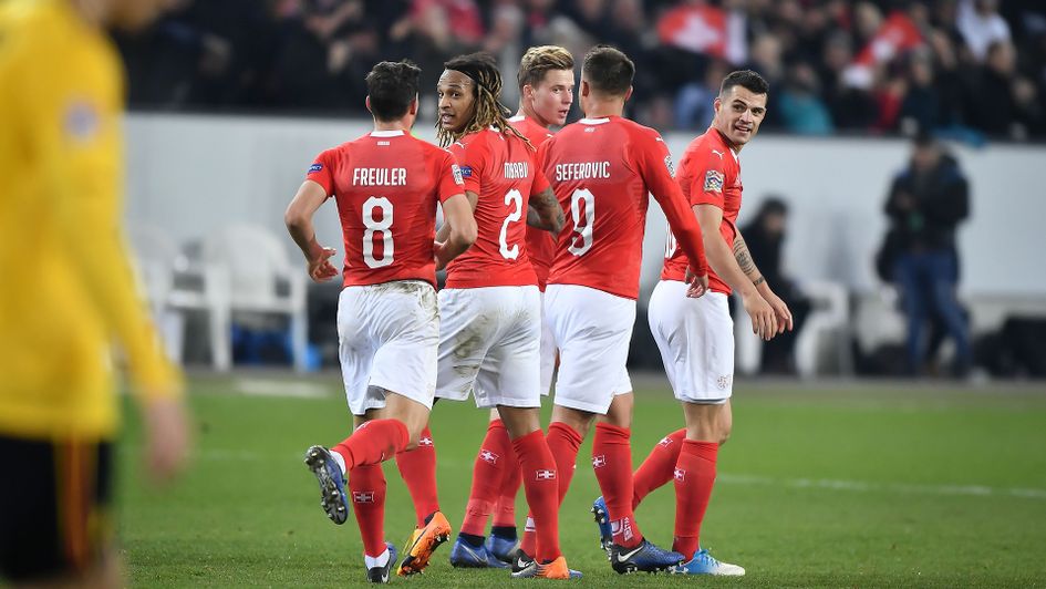Switzerland celebrate one of their five goals against Belgium