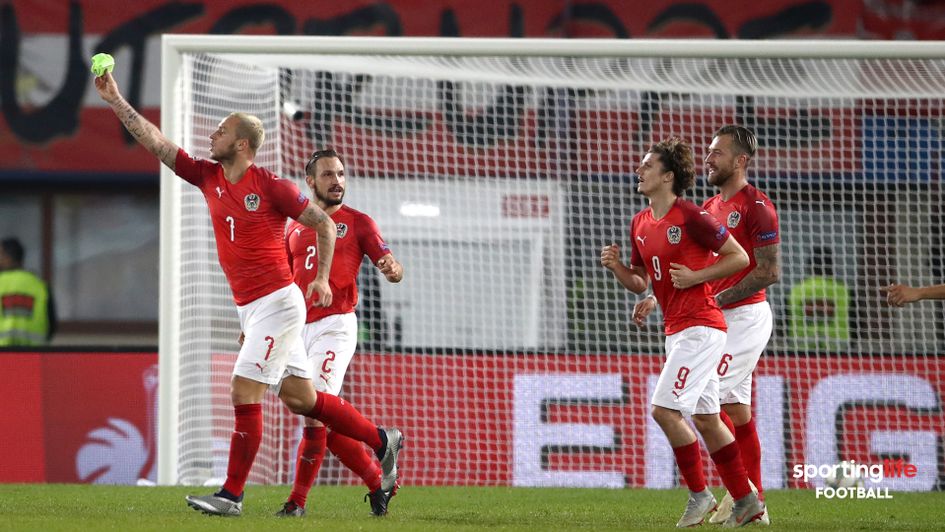 Austria's Marko Arnautovic (left) celebrates scoring against Northern Ireland