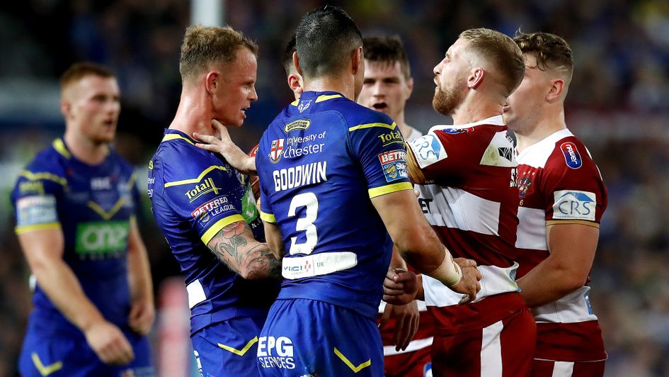 Sam Tomkins (right centre) in conversation with Warrington's Kevin Brown