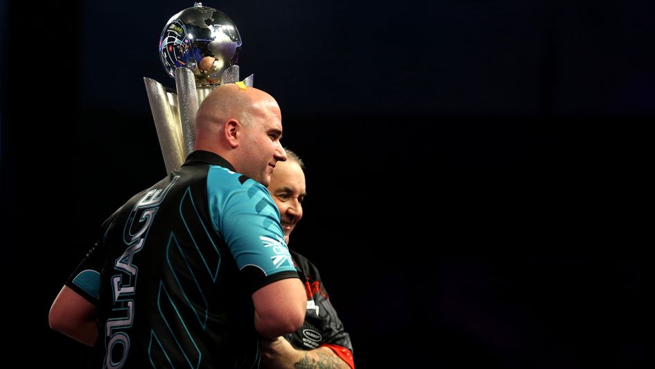 Rob Cross and Phil Taylor lift the trophy together