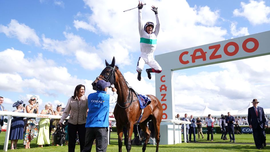 Frankie Dettori celebrates after winning on Mimikyu