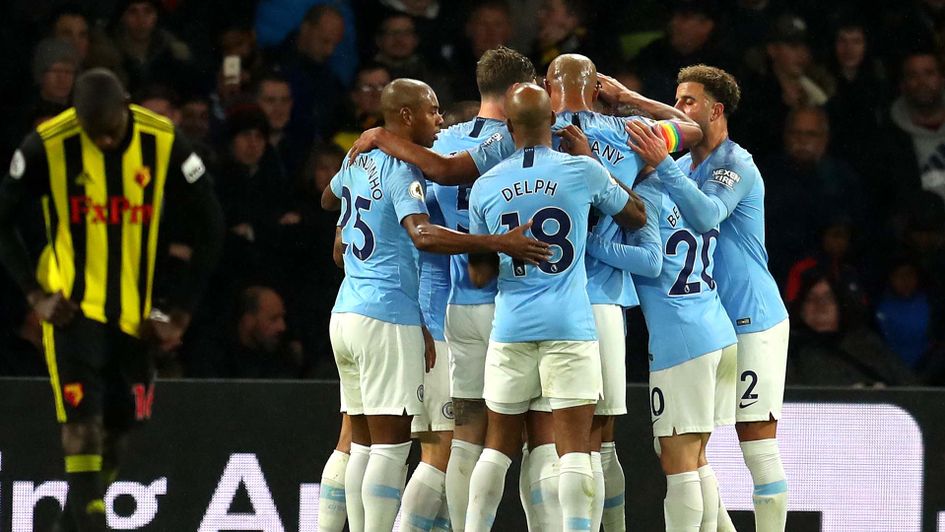 Manchester City players celebrate after a goal against Watford at Vicarage Road