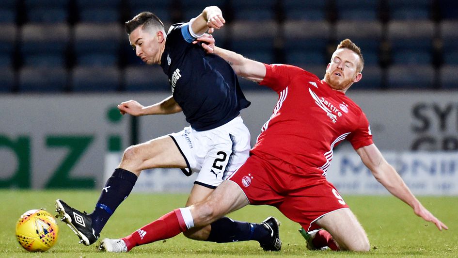 Cammy Kerr does battle with Adam Rooney