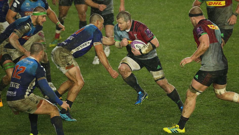 Harlequins' Renaldo Bothma takes contact in a rain soaked contest