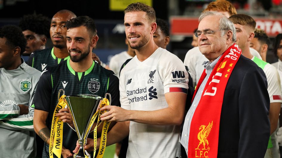 Bruno Fernandes of Sporting Libson and Liverpool's Jordan Henderson share the Western Union cup