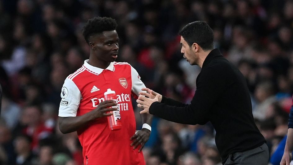 Bukayo Saka and Mikel Arteta