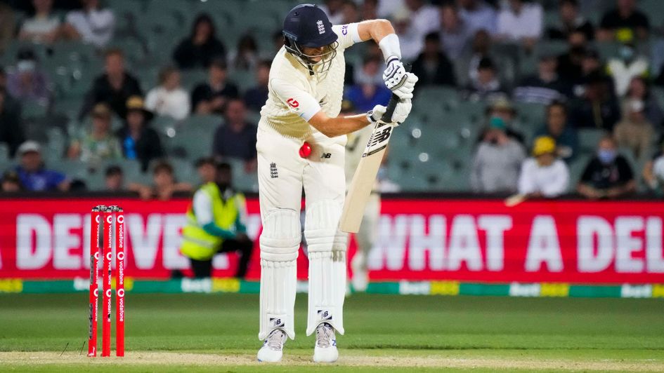 Joe Root of England is hit by a delivery by Mitchell Starc