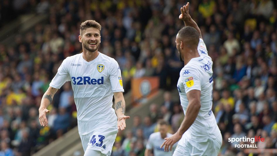 Mateusz Klich and Kemar Roofe celebrate
