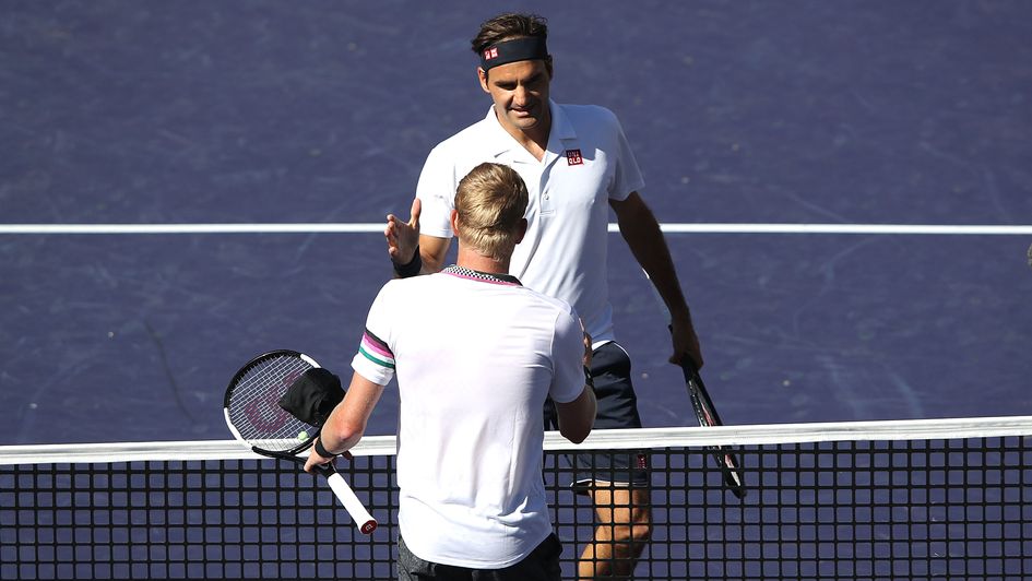Kyle Edmund (front) and Roger Federer shakes hands at the Indian Wells Masters