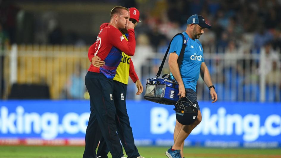 Jason Roy is helped from the field