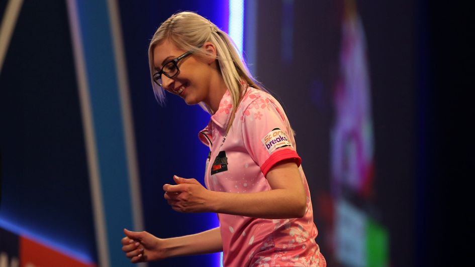 Fallon Sherrock celebrates after beating Mensur Suljovic