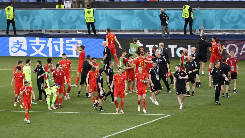 Wales celebrate advancing into the last 16