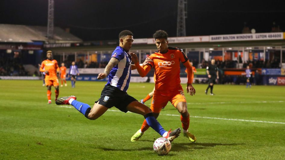 James Justin (orange) in action for Luton