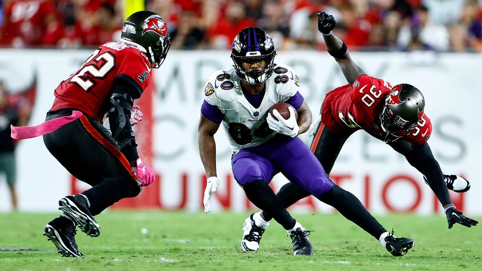 Isaiah Likely carries the ball