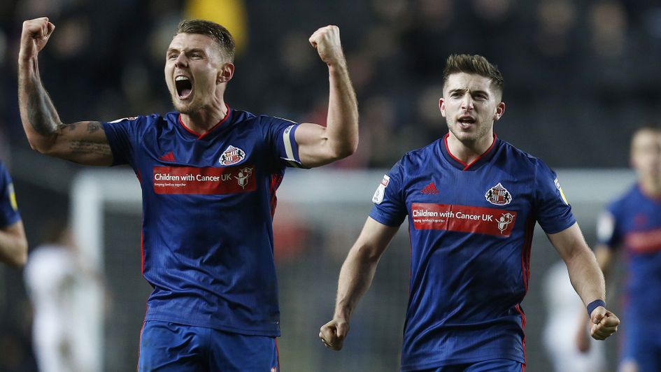 Sunderland's Max Power celebrates with Lynden Gooch