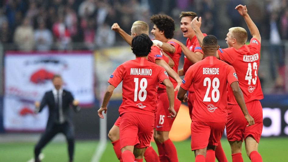 Salzburg players celebrate Erling Braut Haland's goal against Genk in the Champions League group stages