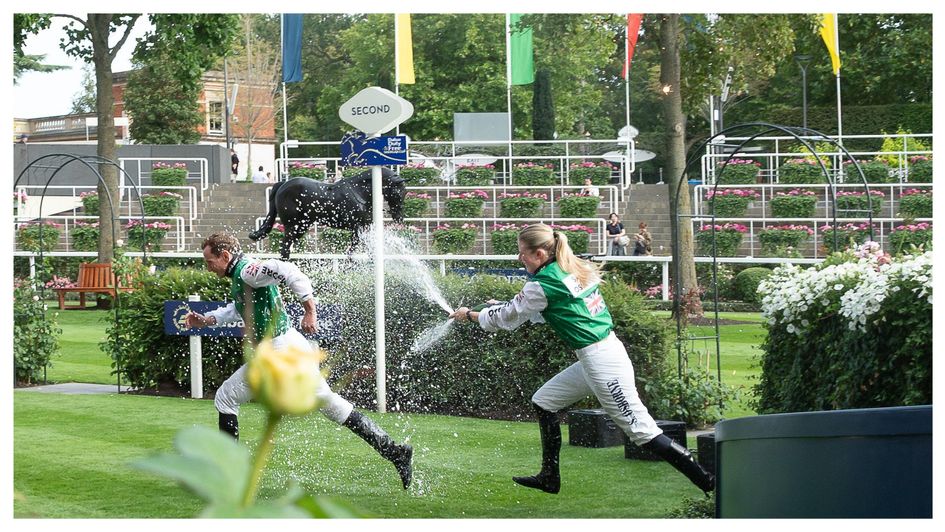 Saffie Osborne sprays Ryan Moore with the winning champagne