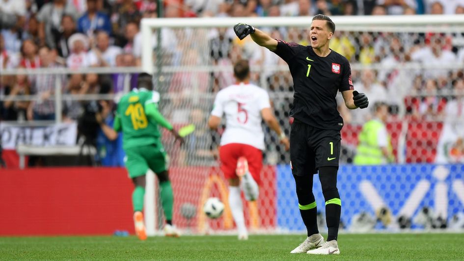 Poland Wojciech Szczesny shouts at his team as Senegal's Mbaye Niang scores behind him