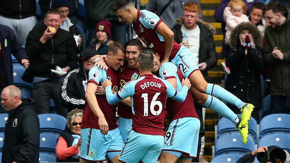 Chris Wood is congratulated by Burnley team-mates