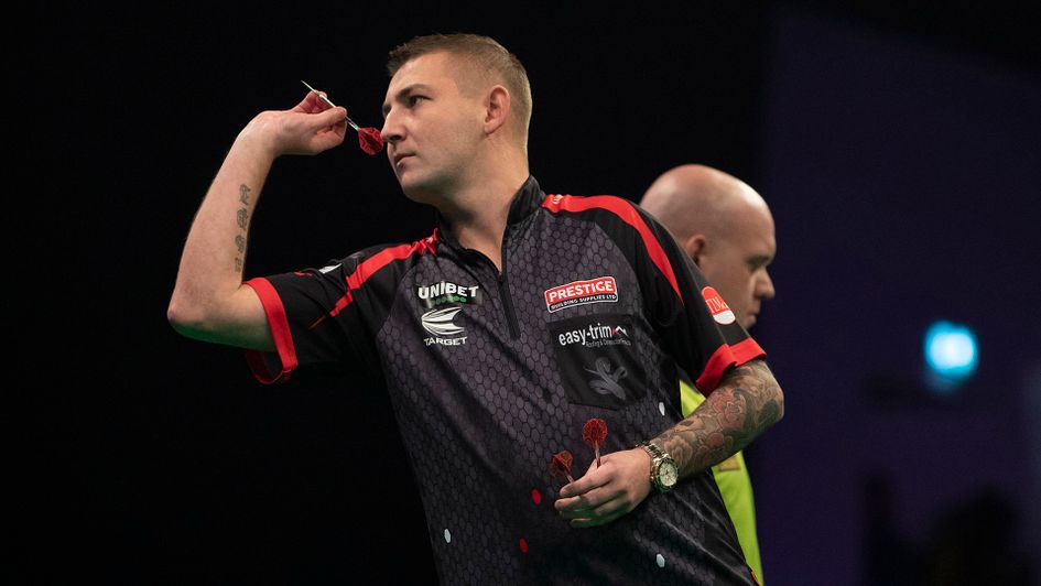 Nathan Aspinall in action against Michael van Gerwen (Picture: Lawrence Lustig/PDC)