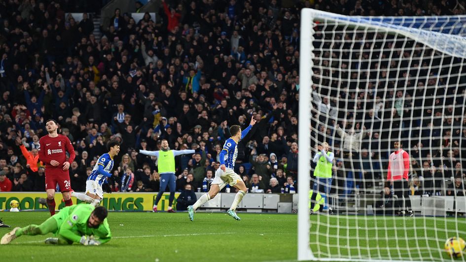 Solly March celebrates a goal against Liverpool