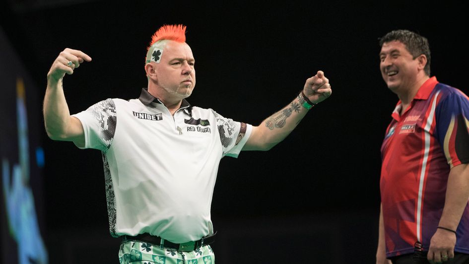 Peter Wright celebrates against Mensur Suljovic (Picture: Lawrence Lustig/PDC)