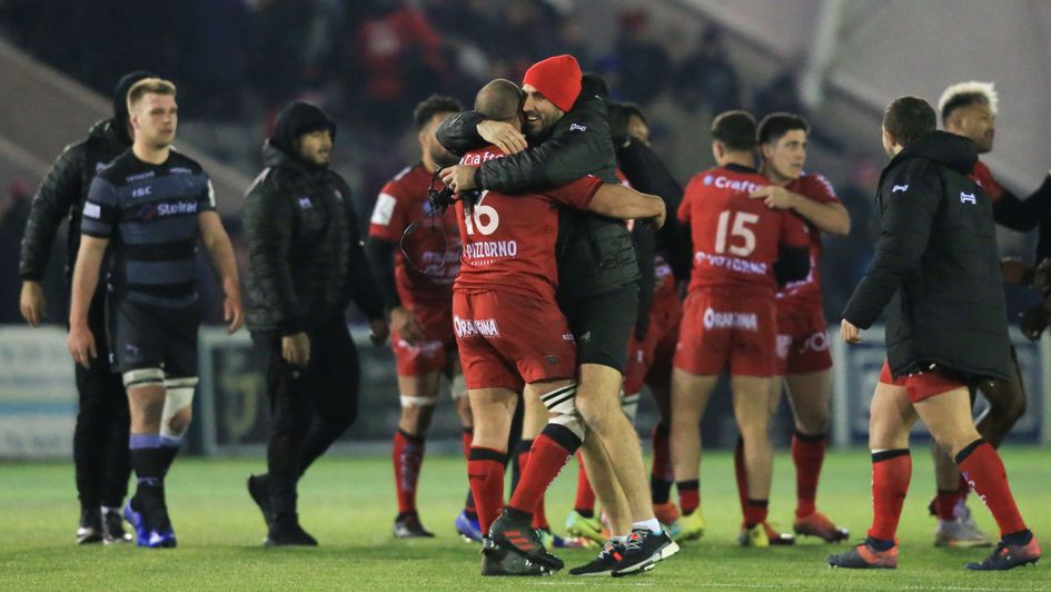 Toulon's Bastien Soury (centre, left) embraces a team-mate at the end of the victory over Newcastle Falcons