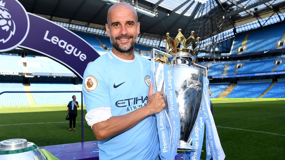 Pep Guardiola with the Premier League trophy