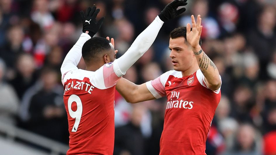 Granit Xhaka (right) celebrates his goal for Arsenal against Manchester United with team-mate Alexandre Lacazette