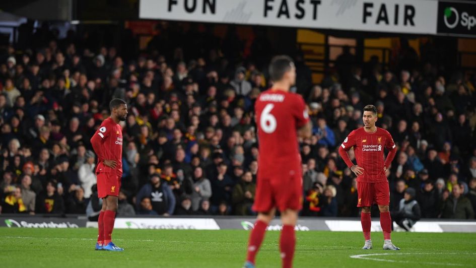 Liverpool players stand defeated at Watford
