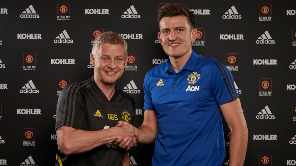 Harry Maguire: England defender (right) shakes hands with Ole Gunnar Solskjaer after joining Manchester United