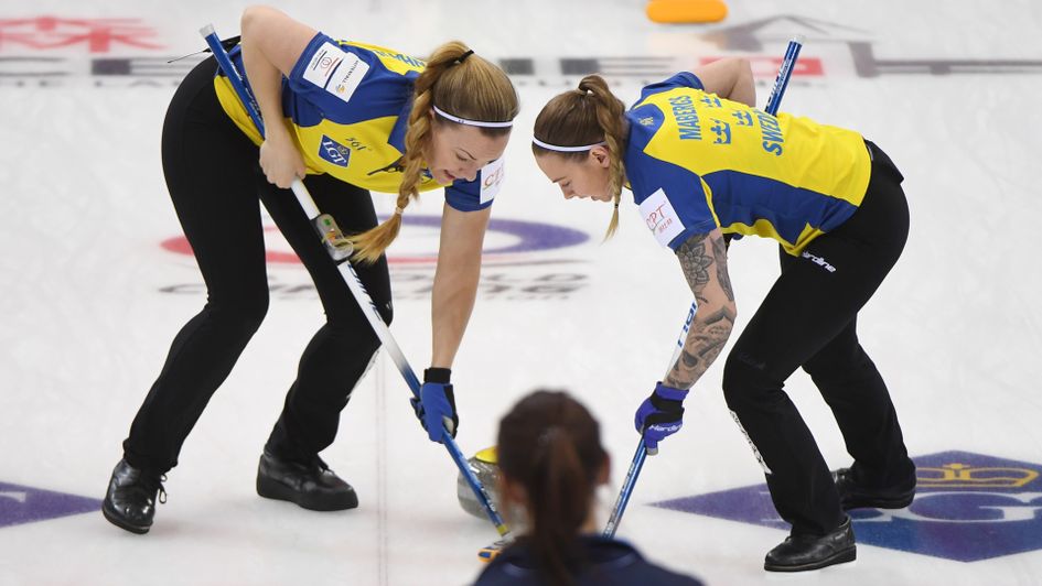 Sweden curling team in action against Great Britain