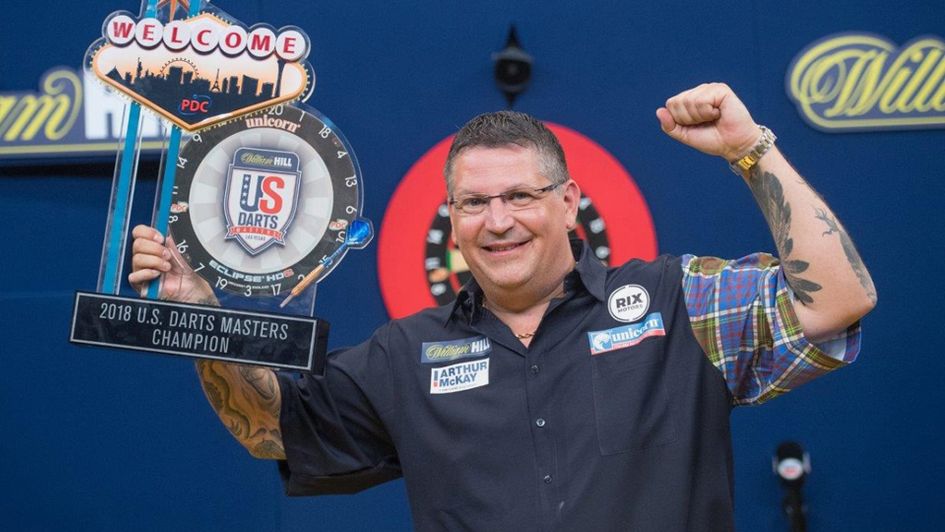 Gary Anderson celebrates with the trophy (Tom Donoghue/PDC)