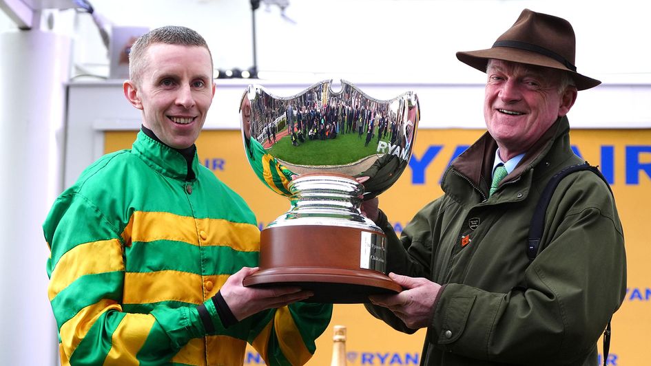 Willie Mullins (right) pictured with Mark Walsh and the Ryanair Chase trophy