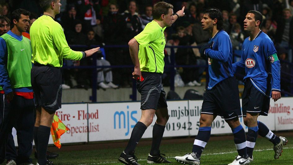 Sergio Aguero is shown a red card against Bolton