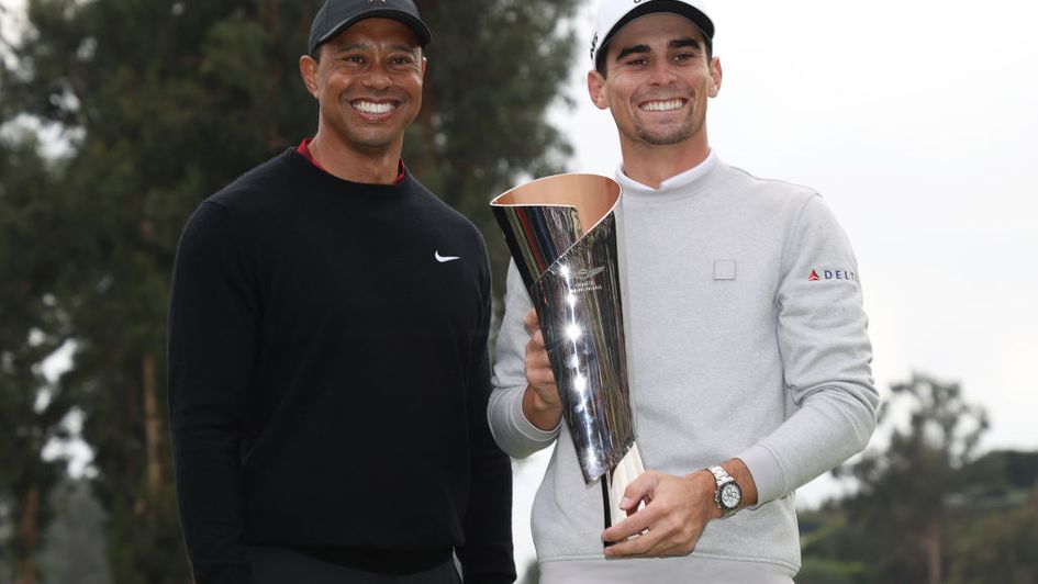 Joaquin Niemann and host Tiger Woods with the Genesis Invitational trophy