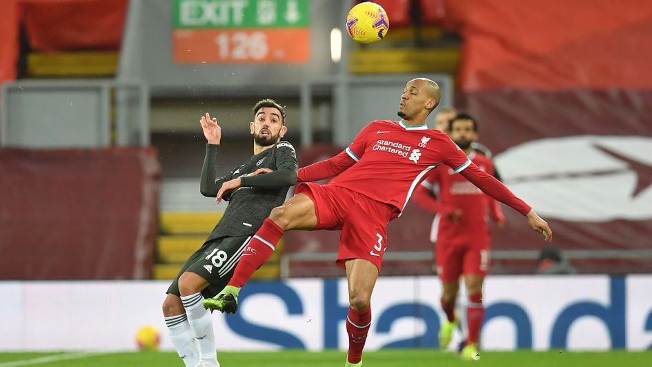 Bruno Fernandes and Fabinho battle for the ball