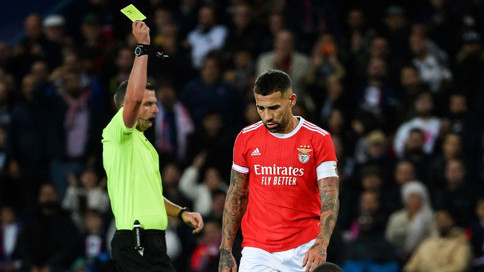 Benfica's Nicolas Otamendi (right) getting booked in the Champions Legaue